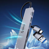 Orico YSA7-U3 USB-A/USB-C Hub Docking Station 4x USB-A 2.0 + 1x USB-A 3.0 + 2x USB-C 2.0 - Grå