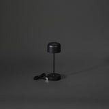 Konstsmide Lille mini sort bordlampe portable